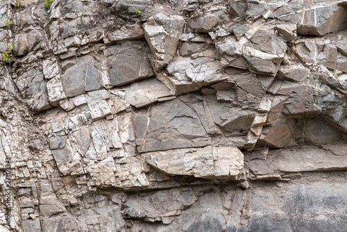 Crumbling rock cliff in the Fraser River Valley, British Columbia, Canada
