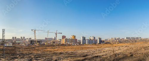 Panorama of the construction site of a residential microdistrict
