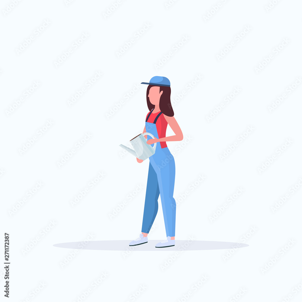 Housewife holding watering can young woman gardener Housewife holding watering can young woman gardener