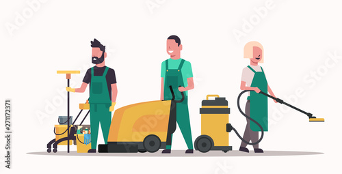 janitors team cleaning service concept male female cleaners in uniform working together with professional equipment flat full length horizontal