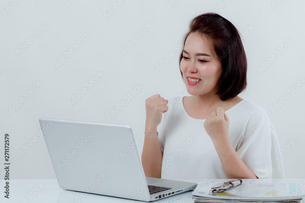 Beautiful Asian woman, white shirt Working Laptop computer Who is on the desk working and expressing joy, smiling happily With a white background Beautiful Asian woman, white shirt Working Laptop computer Who is on the desk working and expressing joy, smiling happily With a white background