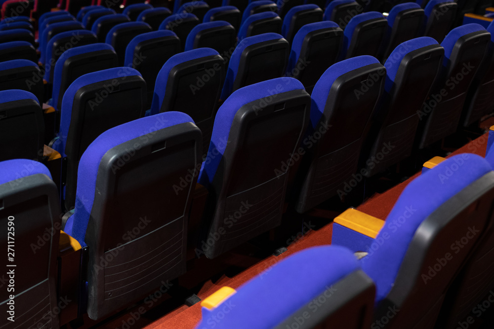 Naklejka premium Enter the blue color for watching the movie. Placed in multiple locations in the theater. Taken from the back