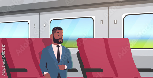 businessman traveling by train african american passenger man in suit sitting on comfortable chair during business trip travel long short distance public transport concept portrait horizontal