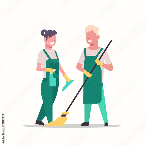 couple janitors man woman in uniform cleaning service concept cleaners holding mop and spray plastic bottle working together full length flat