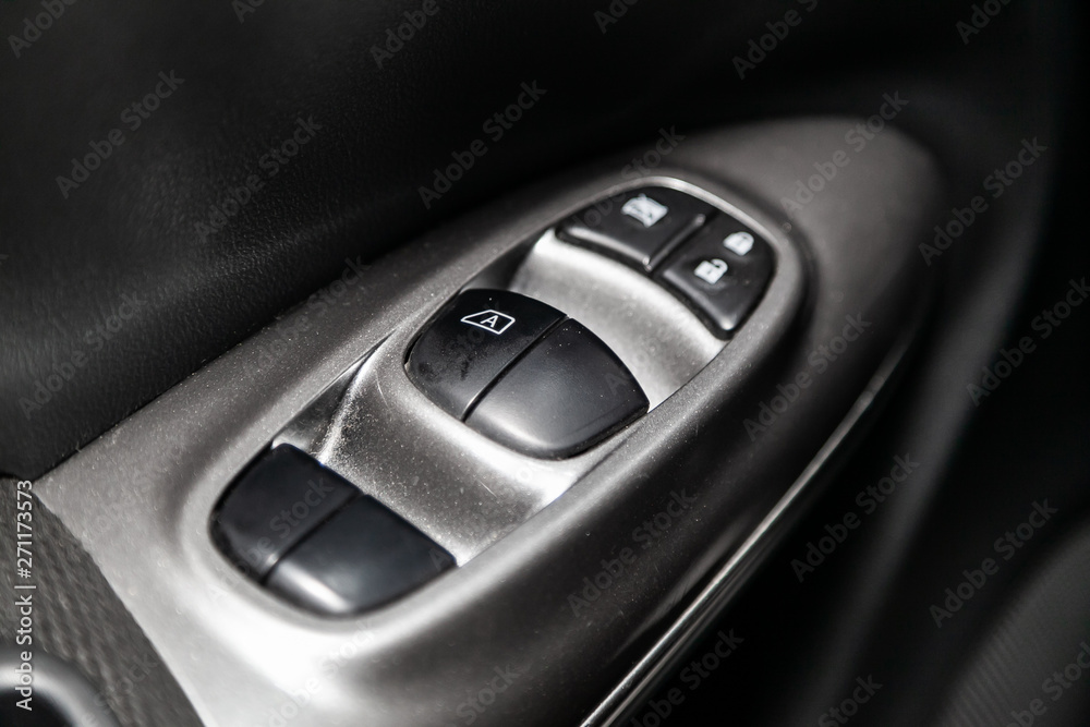 Interior design of the modern car: window adjustment buttons, door lock. luxury prestige car interior. Interior design of the modern car: window adjustment buttons, door lock. luxury prestige car interior.