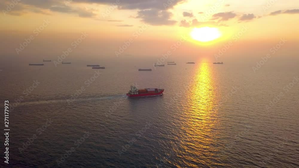 Aerial view from drone, Cargo vessel sail to the sea with peaceful wave in beautiful scenic sky. Professional business logistics and transportation of cargo ship. Aerial view from drone, Cargo vessel sail to the sea with peaceful wave in beautiful scenic sky. Professional business logistics and transportation of cargo ship.