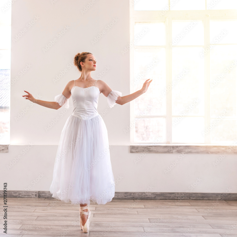 Young graceful ballerina dancing on white studio. Young graceful ballerina dancing on white studio.