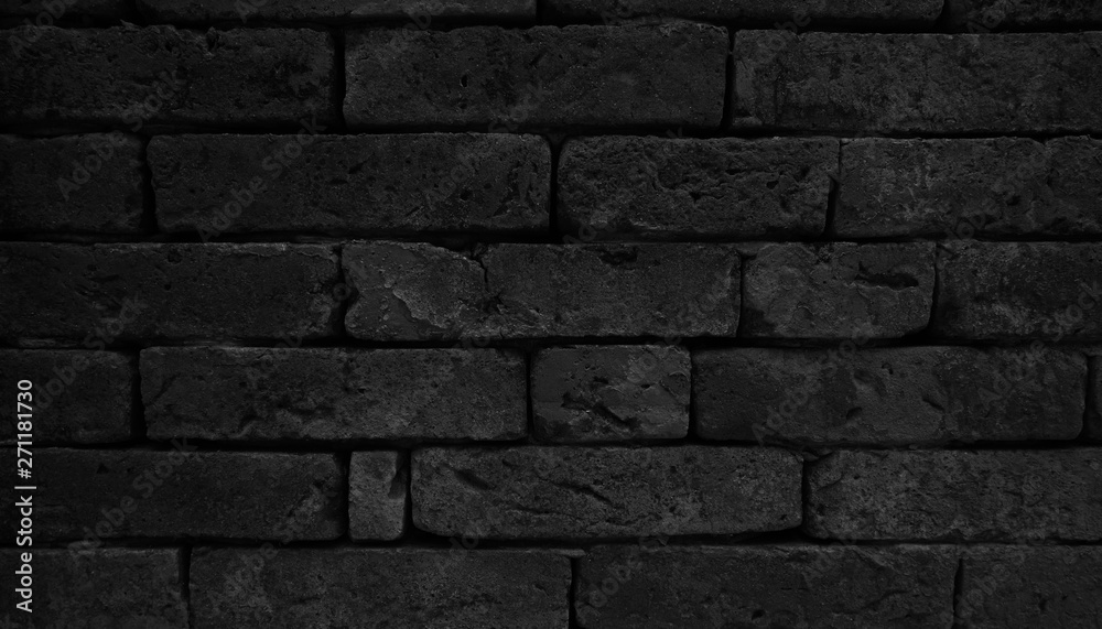 Black brick wall textured for background.