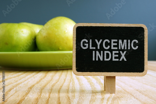 Glycemic index GI concept. Nameplate and plate with apples.