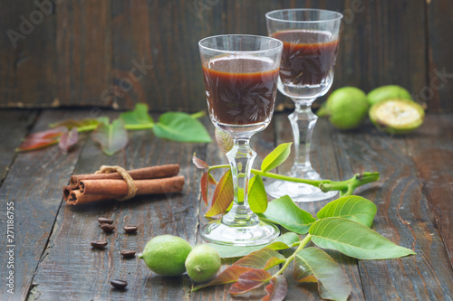 Walnut liquor. Green homemade walnuts liqueur taken as remedy for stomach aches