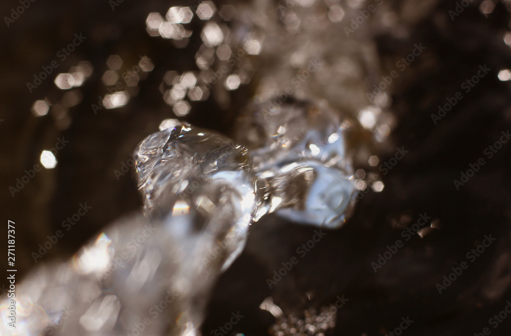 flow of pure spring water on a natural background flow of pure spring water on a natural background