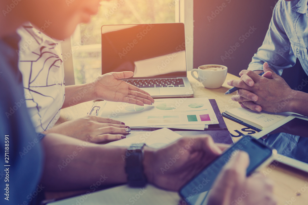 Discussing plan and idea to improvement strategy, businessmen brainstorming for strategy of business investment,businessmen review chart and document of investment information