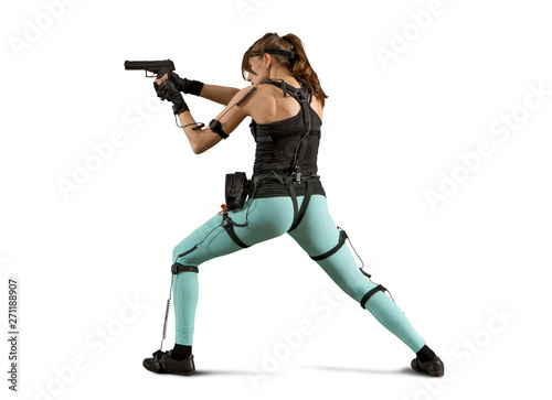 Woman playing on the simulator virtual reality, holding gun