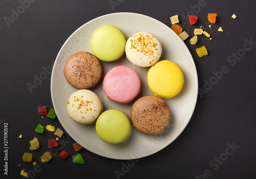 Colorful pastel cake macaron or macaroon on plate.