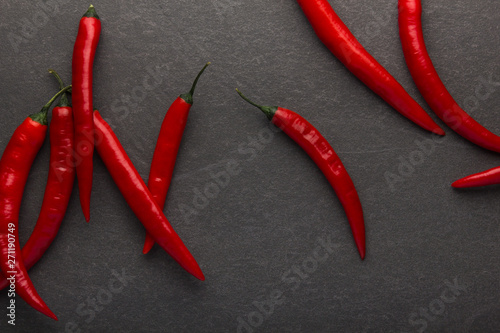 Red hot chili pepper on black background