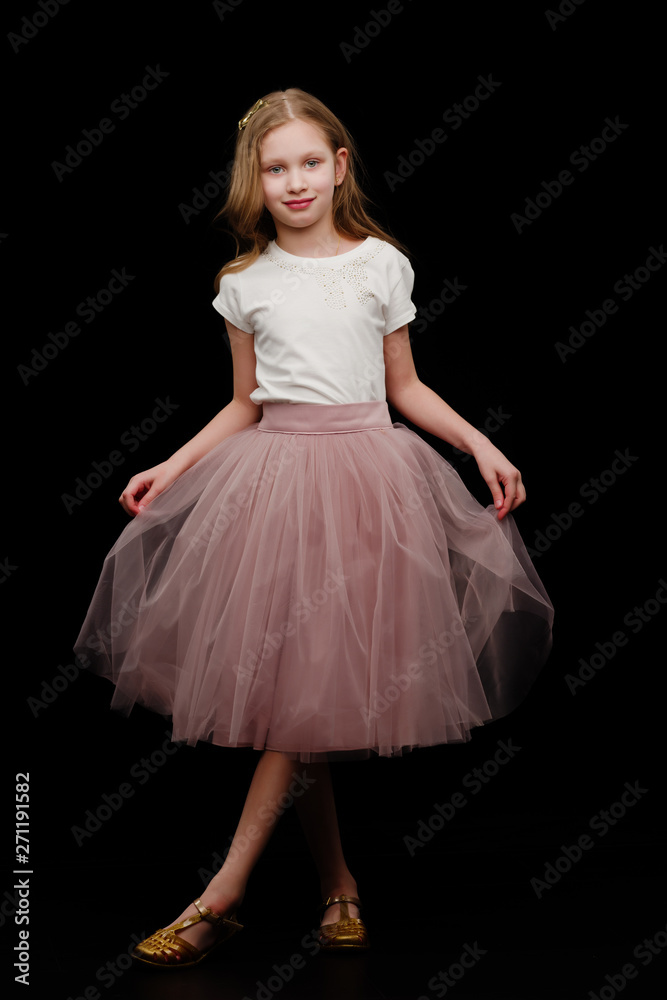 Little girl on a black background