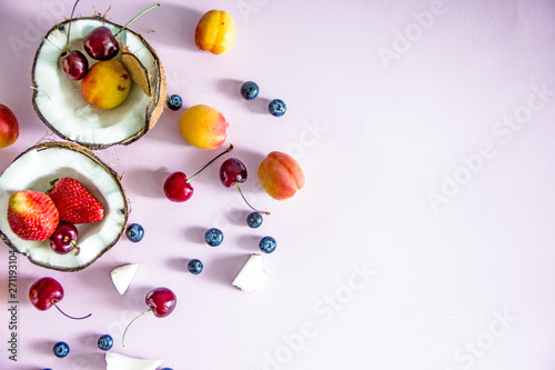 Summer fruit still life flat lay of berries, fruits, top view. Light summer food background