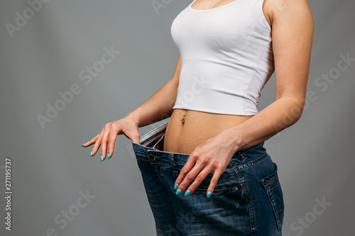 Woman trying jeans photo