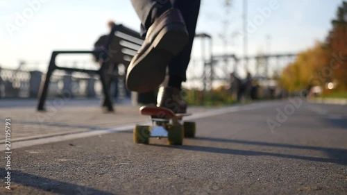 Wallpaper Mural A man in trousers and boots riding a skateboard. HD, 1920x1080, slow motion Torontodigital.ca