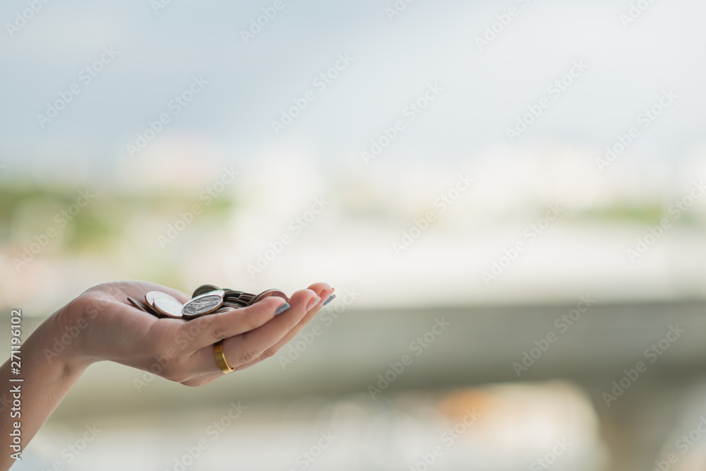 A coins in people hands.Saving money concept A coins in people hands.Saving money concept