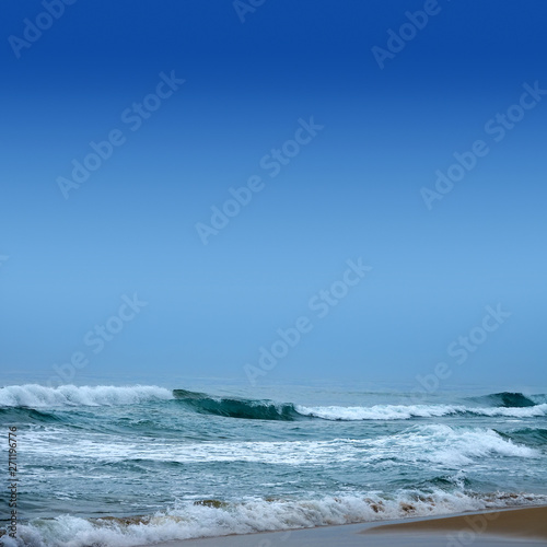 Seascape image of beautiful close up waves in moody rainy morning © jokerpro