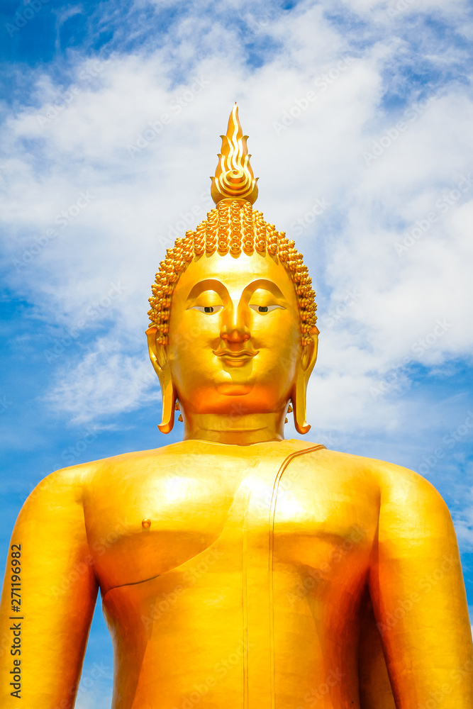 Big Golden Buddha with blue sky blue at Wat Muang, Ang Thong Province, Thailand