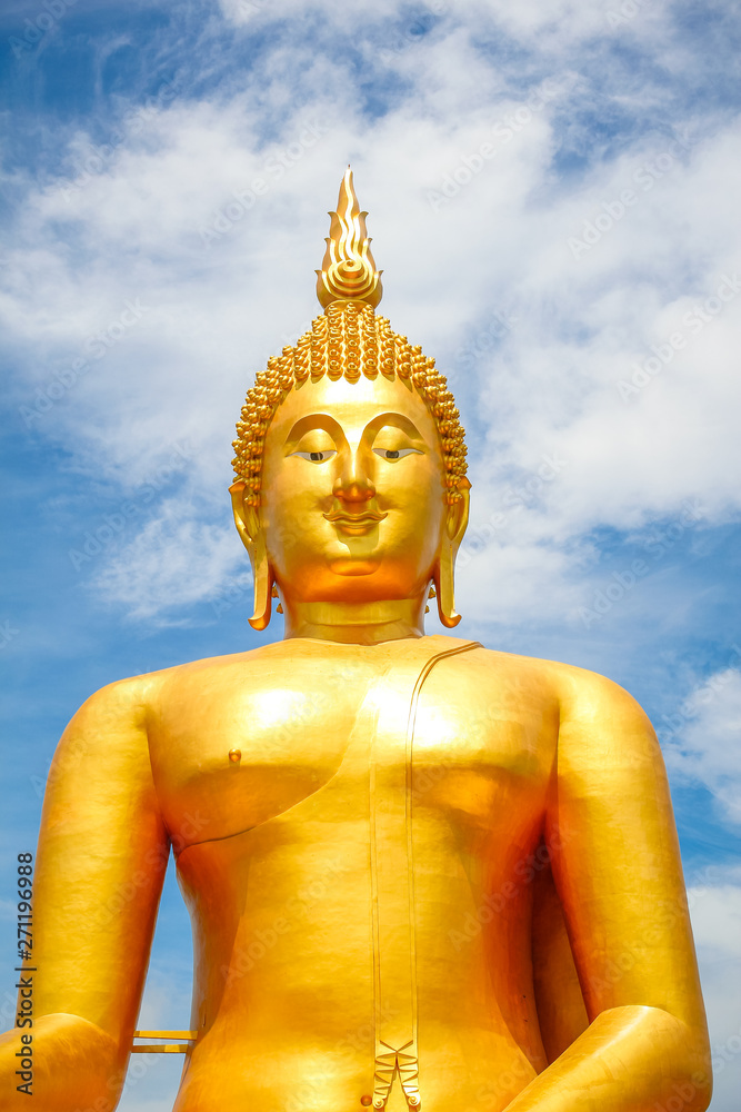 Big Golden Buddha with blue sky blue at Wat Muang, Ang Thong Province, Thailand