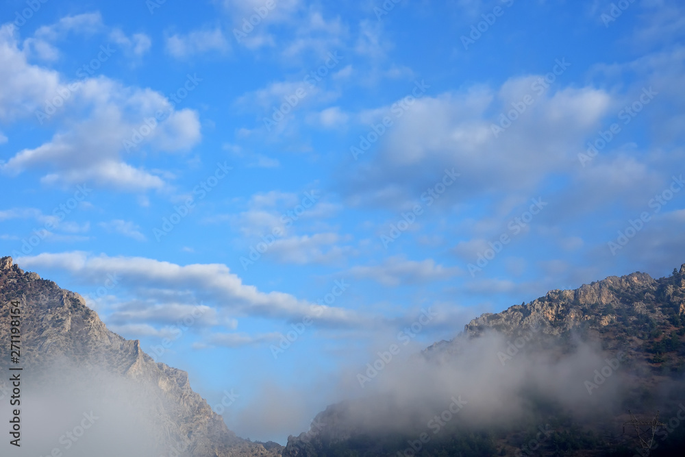 close up fogy mountains over sunny and cloudy morning sky in Kayseri, Turkey close up fogy mountains over sunny and cloudy morning sky in Kayseri, Turkey