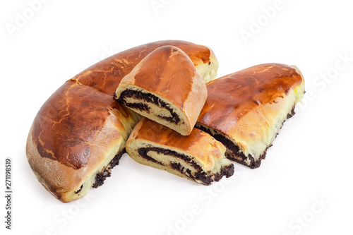 Partly cut poppy seed pies on a white background