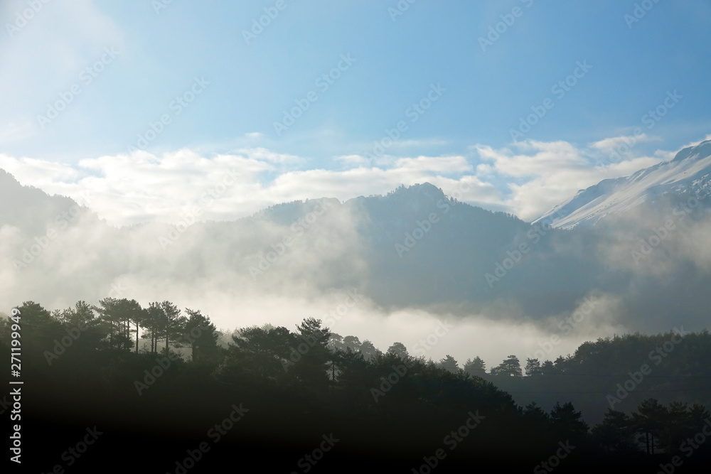 close up fogy mountains and forest over sunny and cloudy morning sky in Kayseri, Turkey