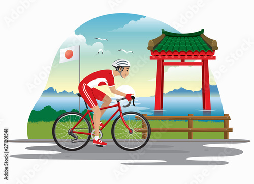 man cycling in japan with japanese gate as bakcground