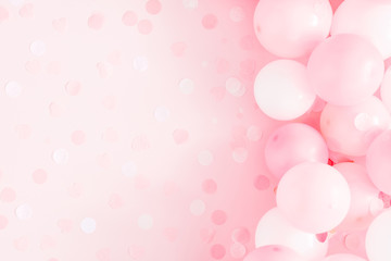 Balloons on pastel pink background. Frame made of white and pink balloons. Birthday, holiday concept. Flat lay, top view, copy space