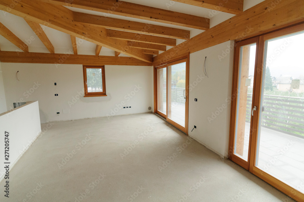 Home renovation: large open space with exposed wooden beams