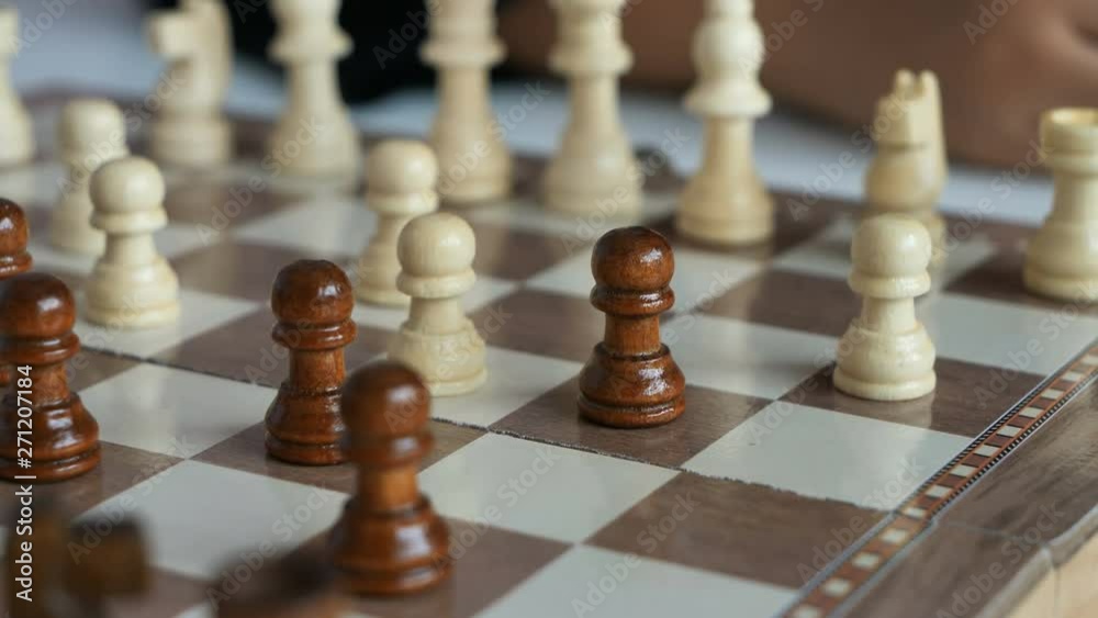 Close-up shot hand of woman playing the chess board metaphor business competition for win and lose select focus shallow depth of field Close-up shot hand of woman playing the chess board metaphor business competition for win and lose select focus shallow depth of field