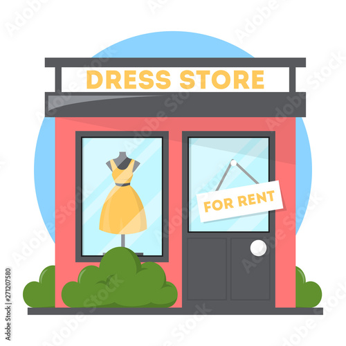 Clothes store with dress on the showcase. Boutique facade