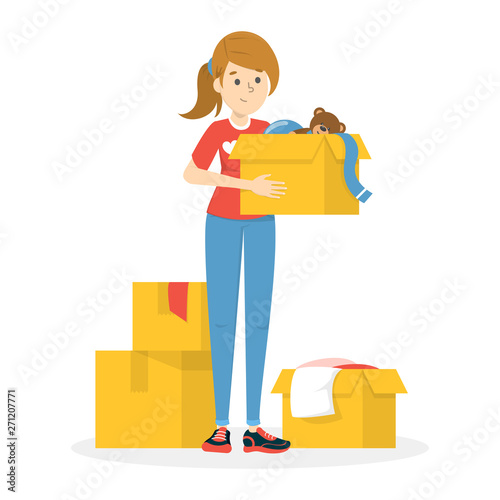 Volunteer holding box with clothes for poor people