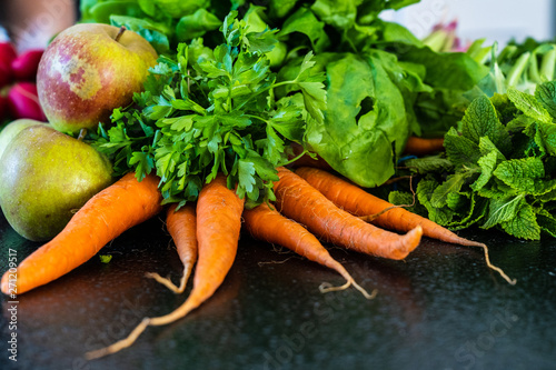 Raw vegetables and fruits on table photo