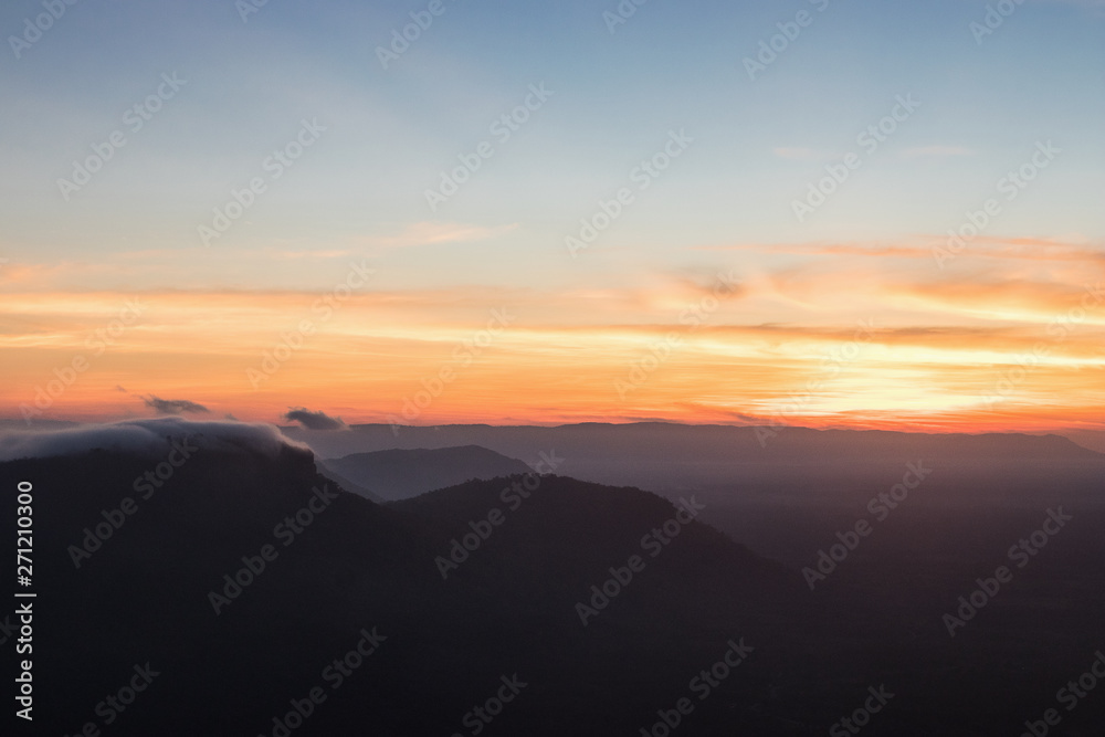 The sunrise view with mist on the mountian at Pha Mor E Dang, Khao Phra Wihan National Park, Thailand.