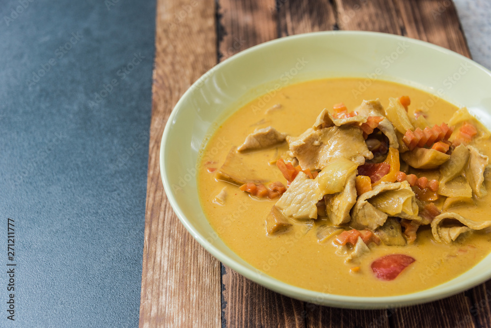 Beautiful yellow soup dishes with fresh vegetables of Chinese Food Dishes
