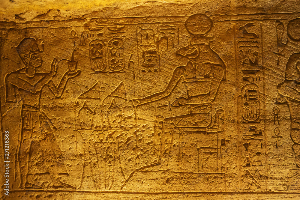 Fototapeta premium Bas relief of the Pharaoh giving offerings in the Great Temple of Abu Simbel