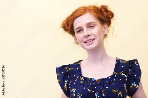 Fotografija Beautiful young redhaired girl with curly-headed hairs