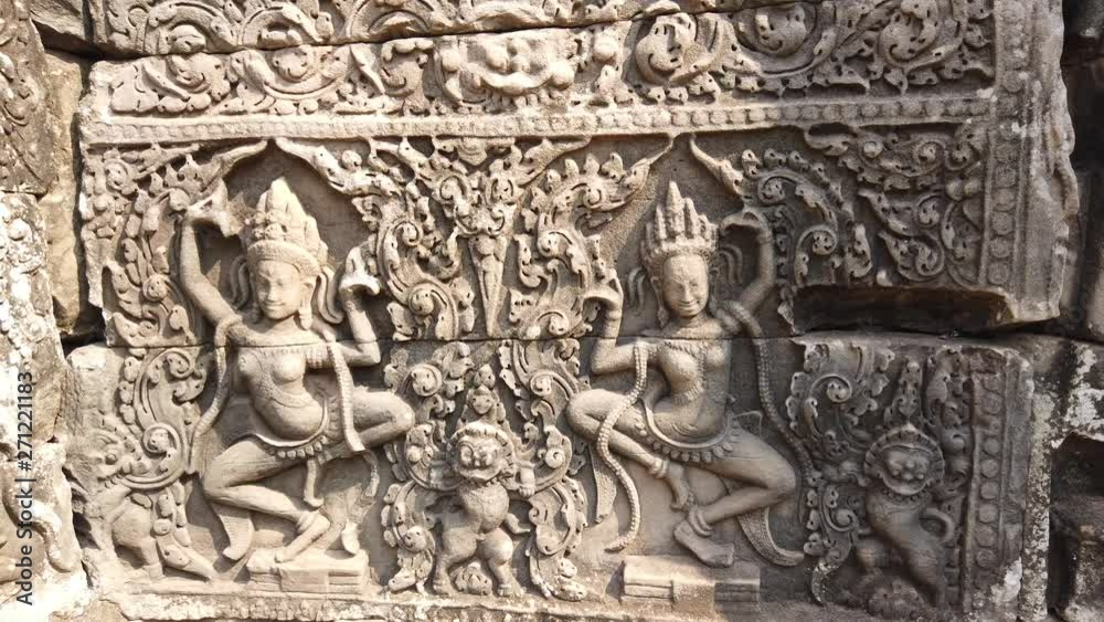 The image of the divine dancers of Apsara in the ancient temple of Bayon, Angkor Wat, Cambodia. The image of the divine dancers of Apsara in the ancient temple of Bayon, Angkor Wat, Cambodia.
