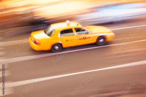 Panning image of a Yellow Taxi cab in Times Square  New York City. New York. USA