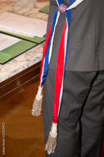 French mayor with scarf flag during celebration weeding day in city hall