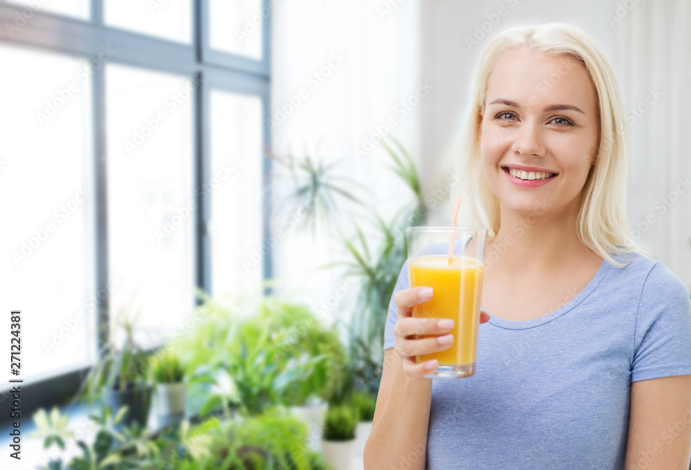 healthy eating, dieting and people concept - smiling woman drinking orange juice from glass at home healthy eating, dieting and people concept - smiling woman drinking orange juice from glass at home