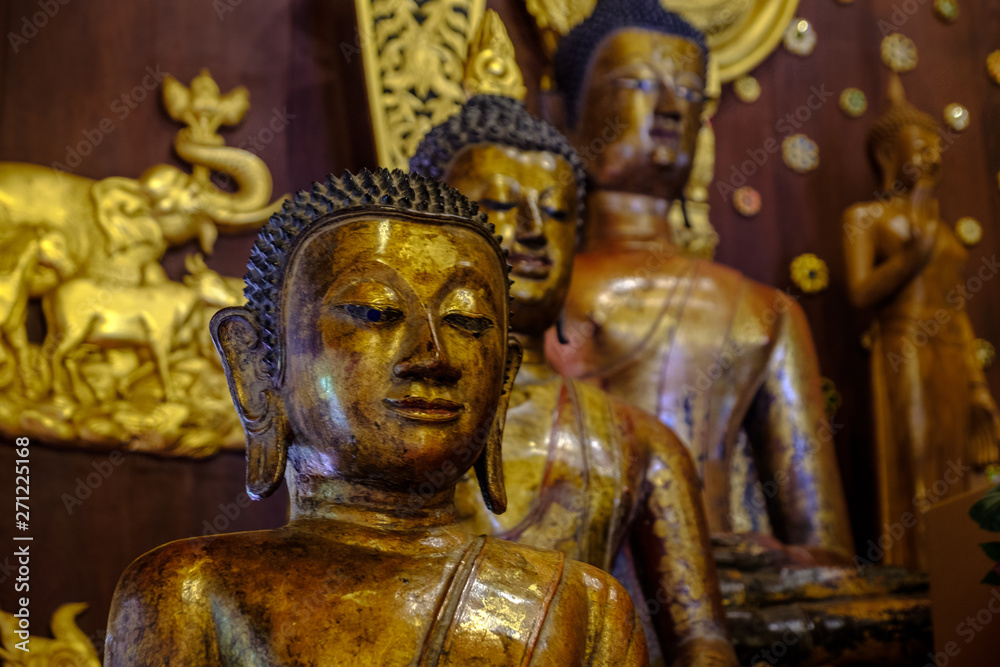 Buddha statues in Wat Phra Kaeo in Chiang Rai, Thailand