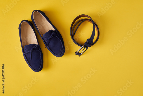 Dark blue suede man's moccasins shoes isolated on white photo