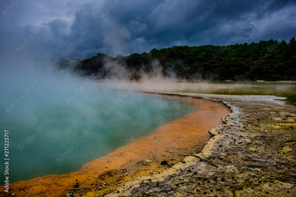Sulphur fumes rising from of the Champagne Pool in Wai-O-Tapu, New Zealand North Island