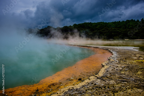 Sulphur fumes rising from of the Champagne Pool in Wai-O-Tapu, New Zealand North Island