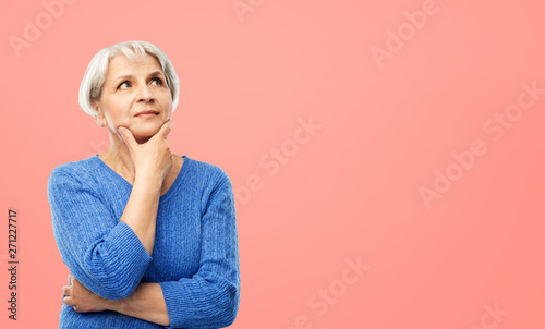 Bild auf Leinwand old people and decision making concept - portrait of senior woman in blue sweate